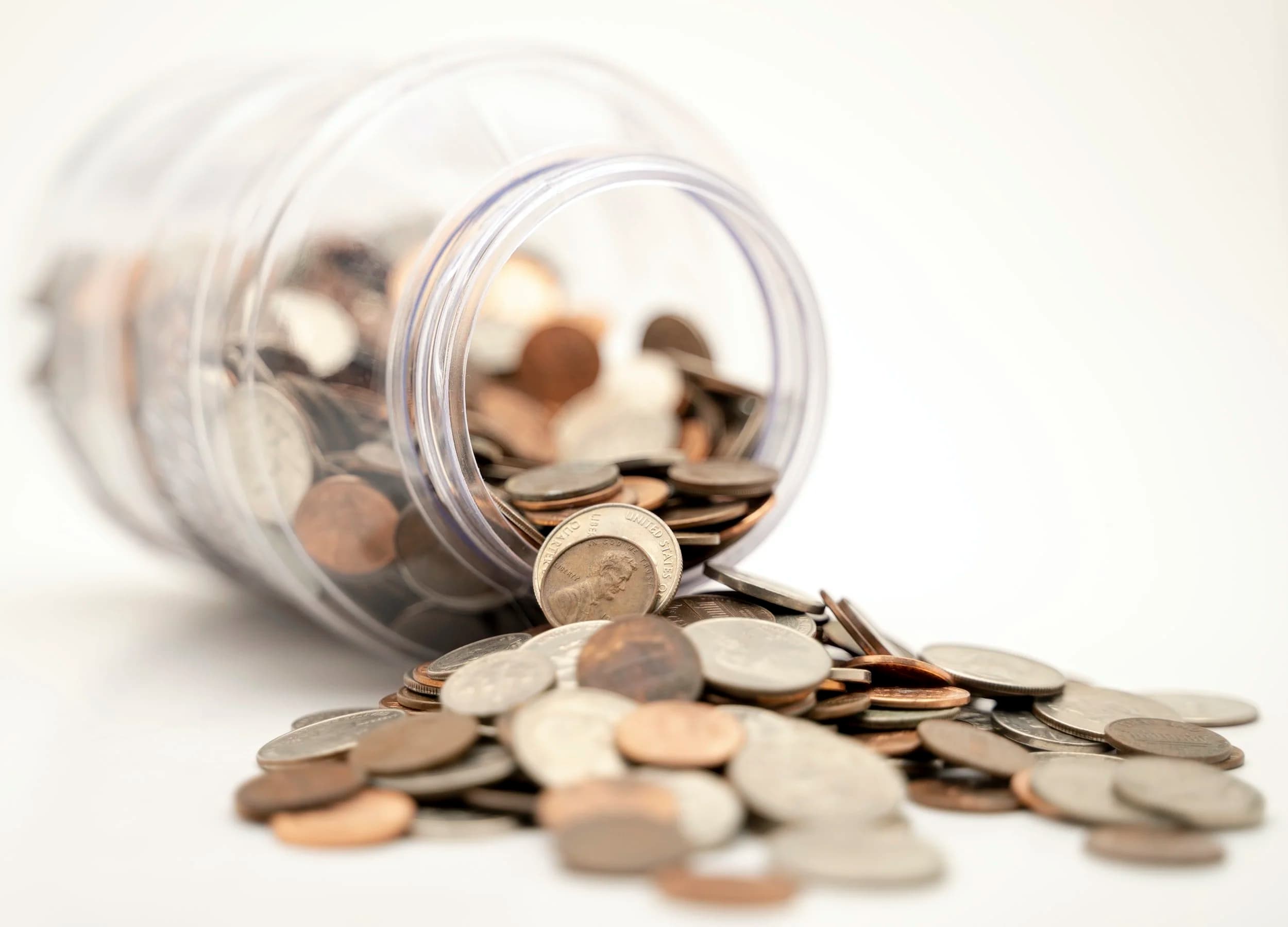 Refund Policy hero artwork showing spilled coins.